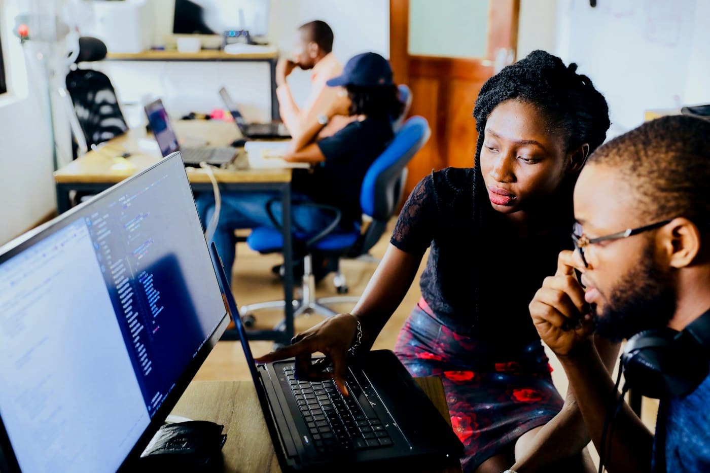 Engineers reviewing work together on a shared screen